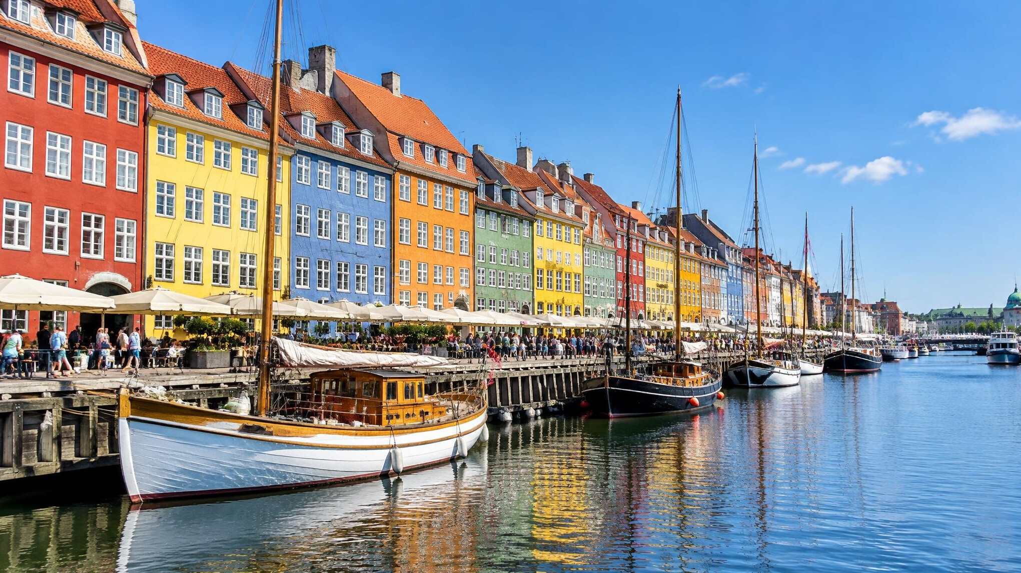 Colorful canal houses along Nyhavn in Copenhagen on a clear day